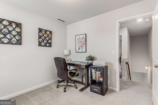 office area featuring carpet flooring, baseboards, and visible vents