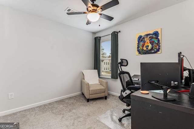 home office featuring carpet floors, baseboards, visible vents, and ceiling fan