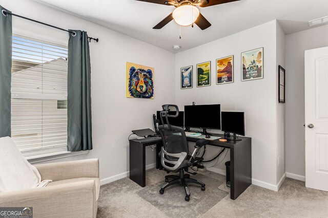 office area with a ceiling fan, carpet, baseboards, and visible vents
