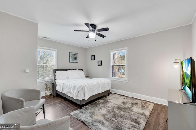 2072 Baker Rd NW, Atlanta, GA 30318 - bedroom featuring visible vents, a ceiling fan, baseboards, and wood finished floors