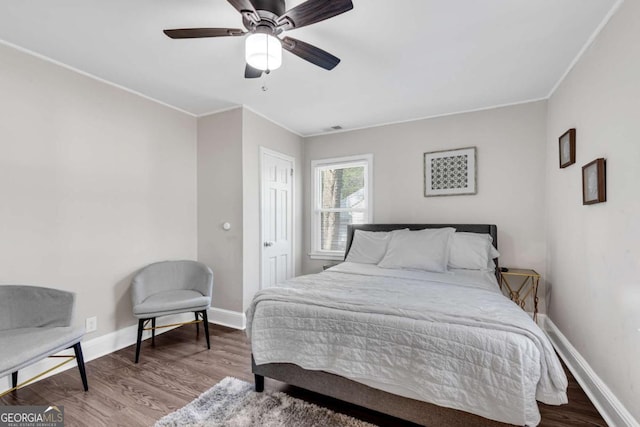 2072 Baker Rd NW, Atlanta, GA 30318 - bedroom featuring wood finished floors, baseboards, and ornamental molding