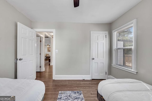 2072 Baker Rd NW, Atlanta, GA 30318 - bedroom featuring baseboards, wood finished floors, and a ceiling fan