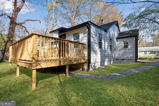 2072 Baker Rd NW, Atlanta, GA 30318 - view of side of home with crawl space, a lawn, and a deck
