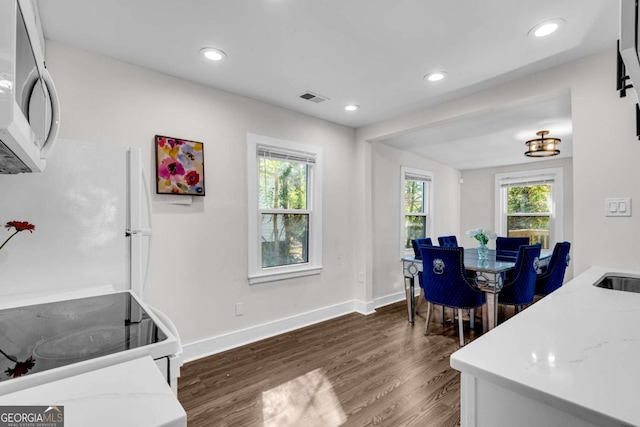 2072 Baker Rd NW, Atlanta, GA 30318 - home office featuring dark wood-style floors, visible vents, recessed lighting, and baseboards