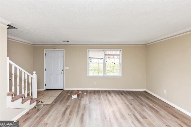 1736 Salem Woods Dr SE, Conyers, GA 30013 - foyer featuring a textured ceiling, stairs, and wood finished floors