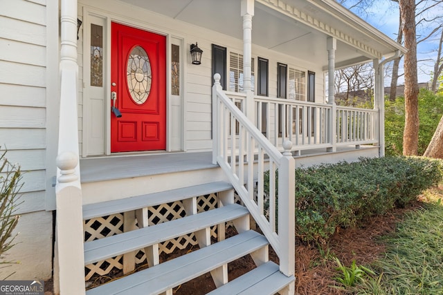 doorway to property featuring a porch