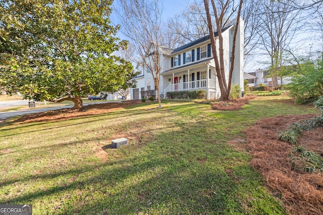view of front of home with a front lawn, a chimney, and a porch