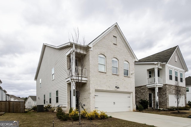 3739 Silvery Way, Powder Springs, GA 30127 - view of front of home featuring brick siding, an attached garage, a balcony, and driveway