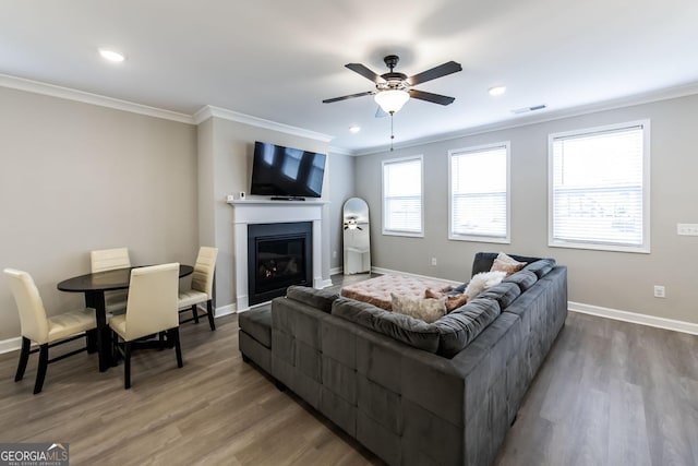 3739 Silvery Way, Powder Springs, GA 30127 - living room with visible vents, crown molding, baseboards, wood finished floors, and a ceiling fan