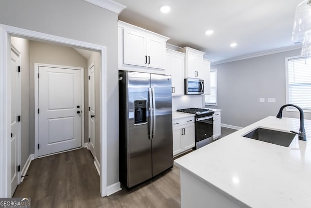 3739 Silvery Way, Powder Springs, GA 30127 - kitchen featuring ornamental molding, a sink, stainless steel appliances, white cabinets, and decorative backsplash