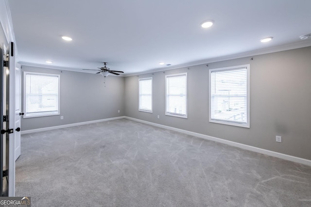 3739 Silvery Way, Powder Springs, GA 30127 - spare room with baseboards, light colored carpet, ornamental molding, and a ceiling fan