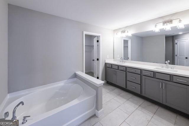 3739 Silvery Way, Powder Springs, GA 30127 - full bathroom featuring a garden tub, double vanity, marble finish floor, and a sink