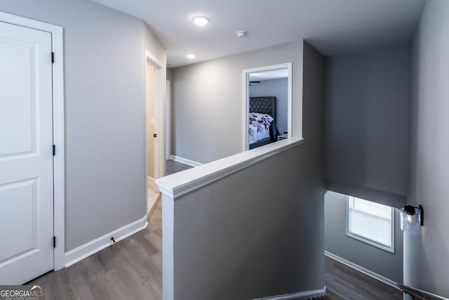 3739 Silvery Way, Powder Springs, GA 30127 - corridor with baseboards, an upstairs landing, and dark wood-style floors
