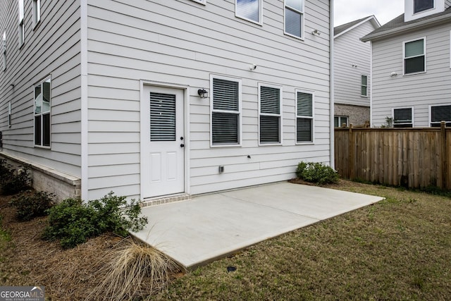 3739 Silvery Way, Powder Springs, GA 30127 - view of exterior entry with a yard, fence, and a patio area