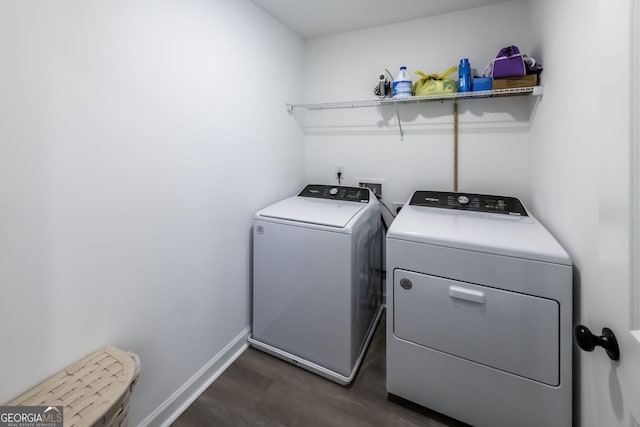 3739 Silvery Way, Powder Springs, GA 30127 - clothes washing area with baseboards, separate washer and dryer, dark wood finished floors, and laundry area