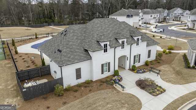 3739 Silvery Way, Powder Springs, GA 30127 - view of front of home with a fenced backyard, a residential view, and roof with shingles