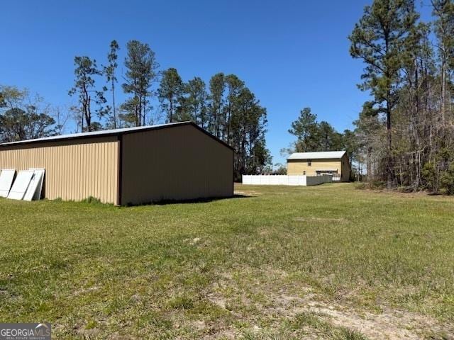 view of yard with an outdoor structure and an outbuilding