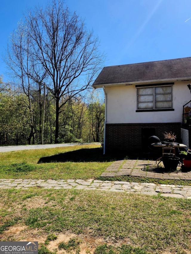 778 Mission Ridge Rd, Rossville, GA 30741 - view of property exterior with brick siding, stucco siding, and a yard