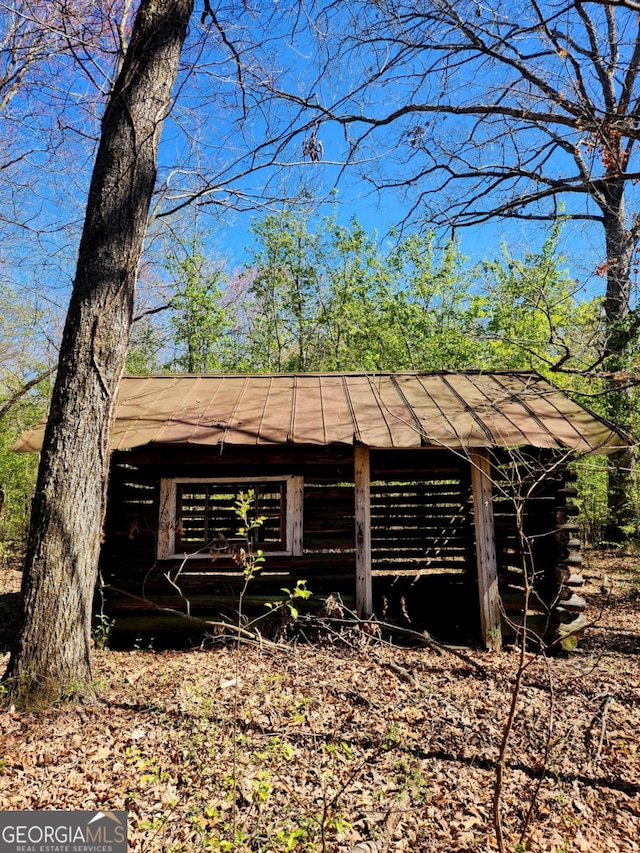 778 Mission Ridge Rd, Rossville, GA 30741 - view of side of property featuring log siding, an outbuilding, and metal roof