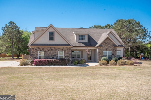 39 Chatham Ct, Williamson, GA 30292 - craftsman-style home with a front lawn, stone siding, and a shingled roof