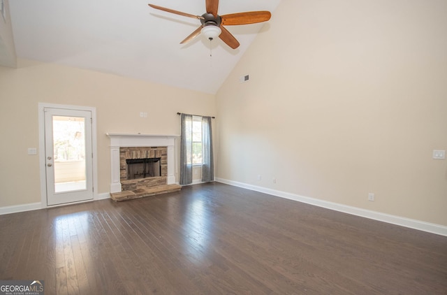 39 Chatham Ct, Williamson, GA 30292 - unfurnished living room with dark wood-style flooring, baseboards, ceiling fan, a fireplace, and high vaulted ceiling