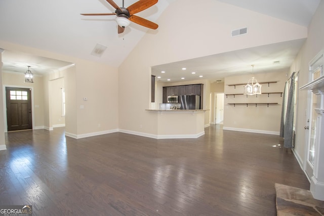 39 Chatham Ct, Williamson, GA 30292 - unfurnished living room featuring dark wood-style flooring, baseboards, visible vents, a ceiling fan, and high vaulted ceiling