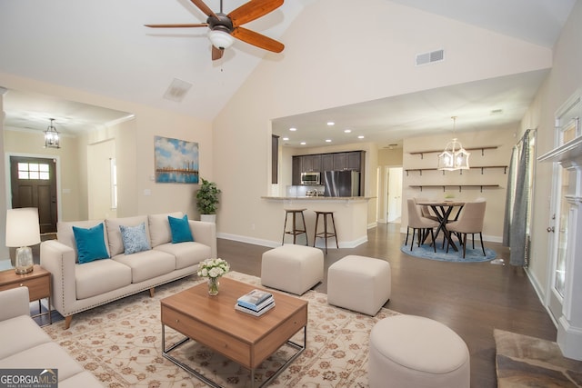 39 Chatham Ct, Williamson, GA 30292 - living room with high vaulted ceiling, a ceiling fan, wood finished floors, baseboards, and visible vents