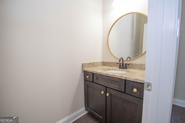 39 Chatham Ct, Williamson, GA 30292 - bathroom featuring wood finished floors, vanity, and baseboards