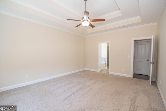 39 Chatham Ct, Williamson, GA 30292 - empty room featuring ceiling fan, a raised ceiling, light colored carpet, ornamental molding, and visible vents
