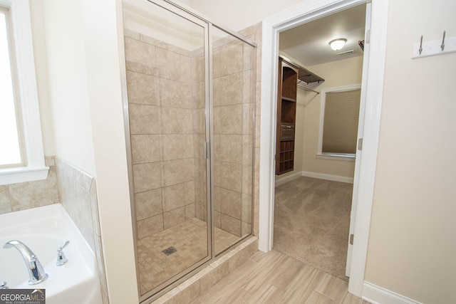 39 Chatham Ct, Williamson, GA 30292 - bathroom with a shower stall, a walk in closet, a bath, and visible vents