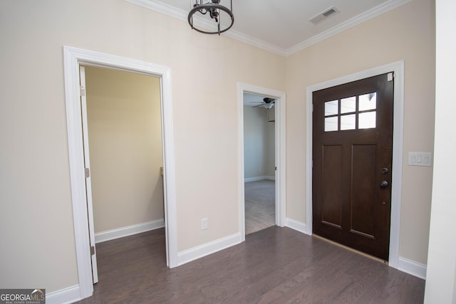 39 Chatham Ct, Williamson, GA 30292 - entryway featuring wood finished floors, visible vents, crown molding, baseboards, and a chandelier