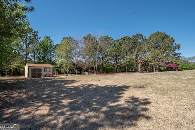39 Chatham Ct, Williamson, GA 30292 - view of yard with an outdoor structure and a shed