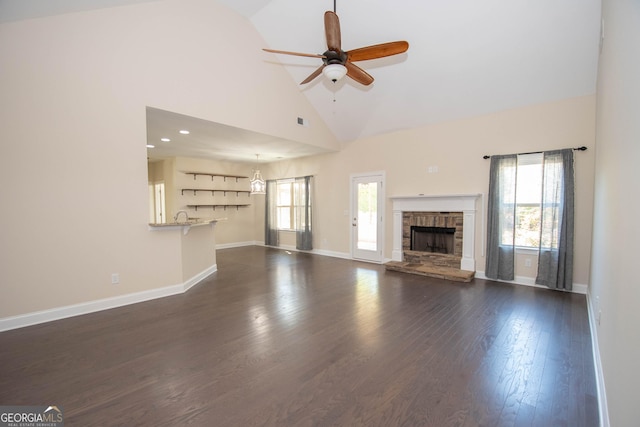 39 Chatham Ct, Williamson, GA 30292 - unfurnished living room featuring a wealth of natural light, dark wood finished floors, ceiling fan, and high vaulted ceiling