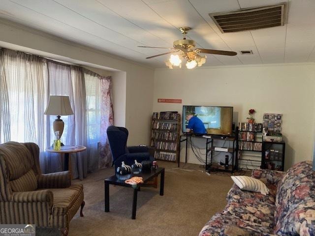 carpeted living room featuring a ceiling fan and visible vents