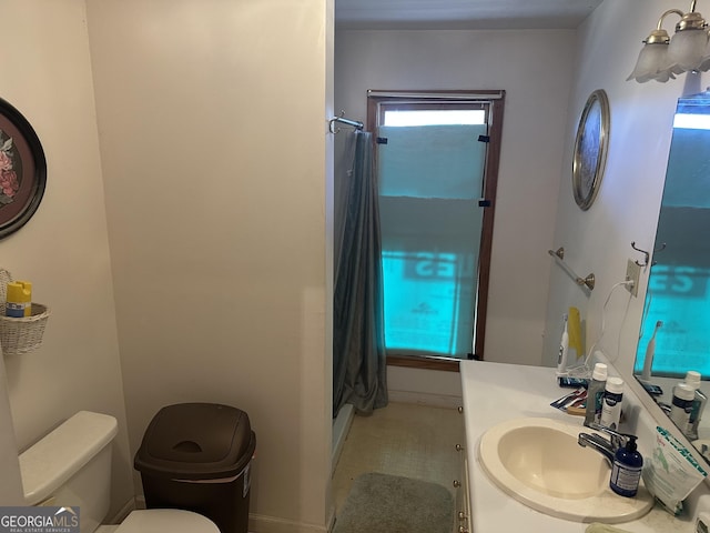 full bathroom with vanity, a shower with shower curtain, and toilet