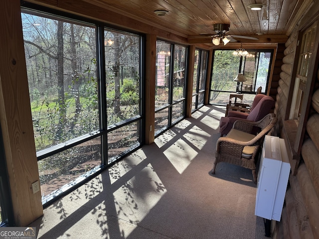 sunroom / solarium with a ceiling fan