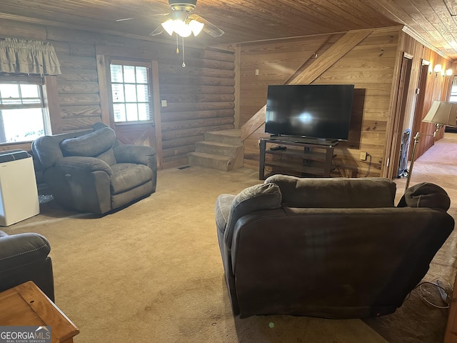 living room featuring wood ceiling, log walls, carpet, and a ceiling fan