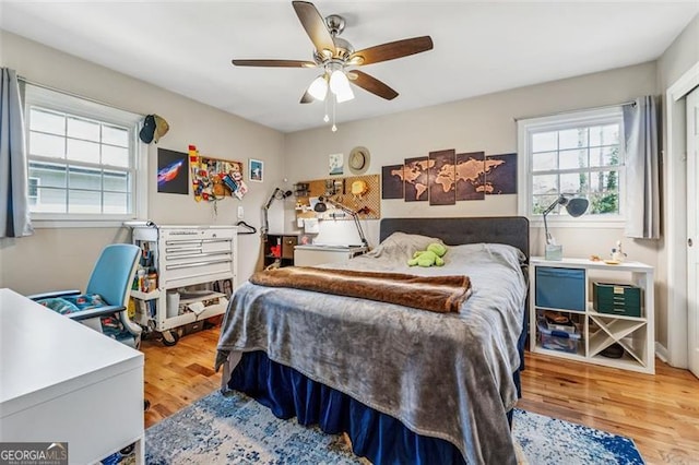 bedroom featuring wood finished floors and a ceiling fan