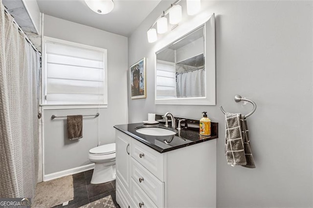 bathroom with a shower with curtain, toilet, and vanity