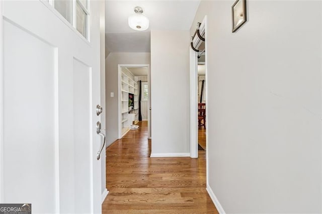 entryway featuring light wood-type flooring and baseboards