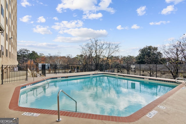 community pool featuring fence