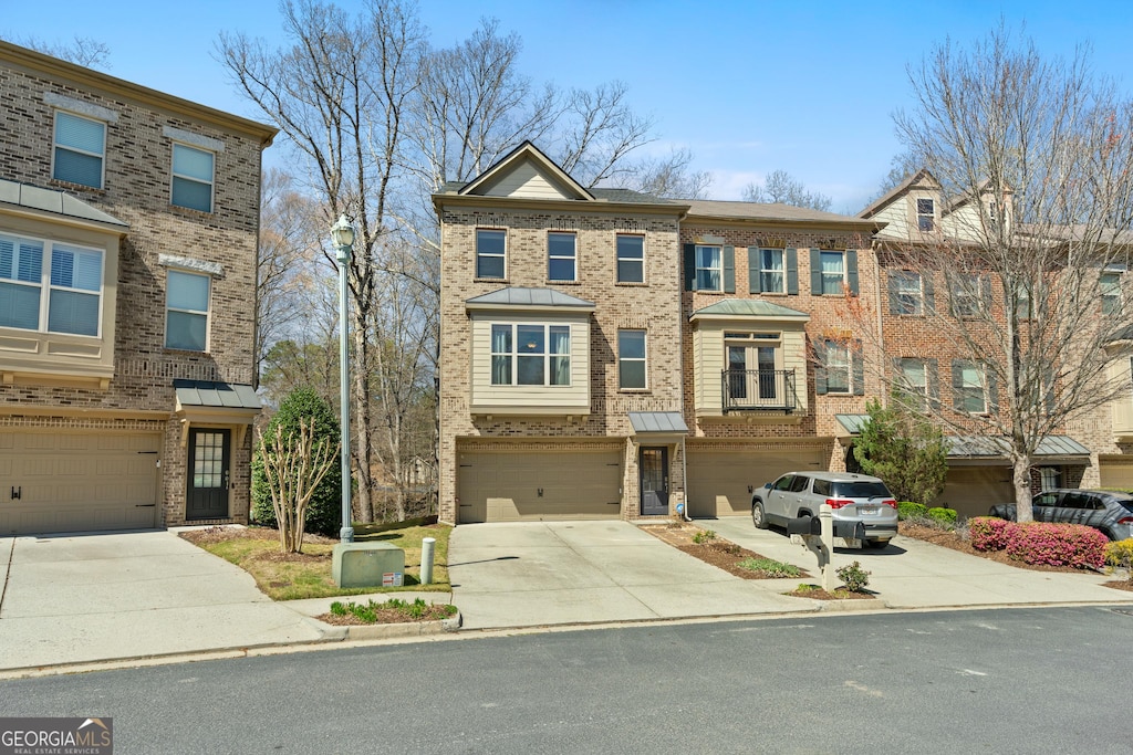 2782 Laurel Valley Trl, Buford, GA 30519 - multi unit property with brick siding, concrete driveway, and an attached garage