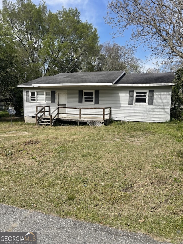 143 Oak St, Cochran, GA 31014 - view of front of home featuring crawl space, a front yard, and a wooden deck