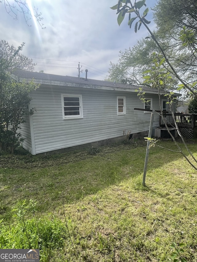 143 Oak St, Cochran, GA 31014 - rear view of property featuring a lawn, crawl space, and a deck