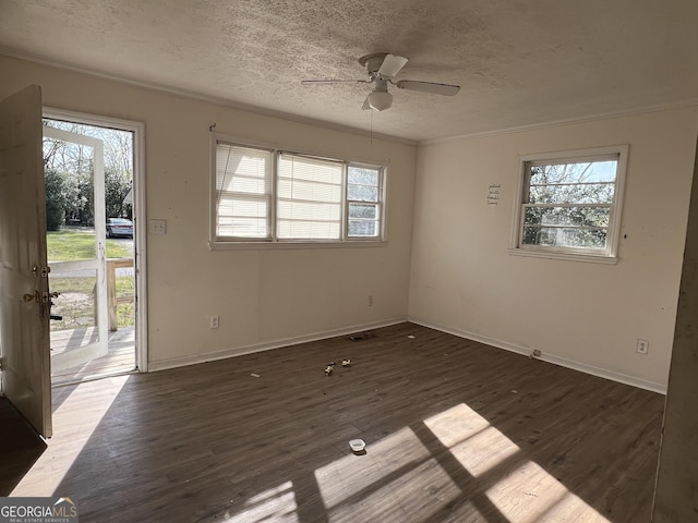 143 Oak St, Cochran, GA 31014 - unfurnished room with dark wood-style flooring, a ceiling fan, and plenty of natural light
