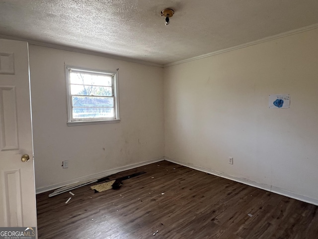 143 Oak St, Cochran, GA 31014 - spare room featuring baseboards, wood finished floors, and a textured ceiling