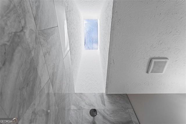 room details with visible vents and a shower