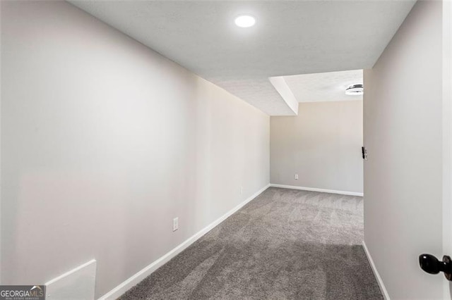 finished below grade area with baseboards, recessed lighting, and carpet floors
