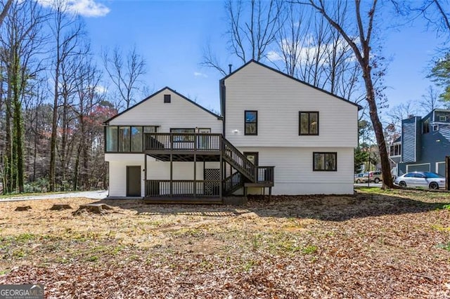 rear view of house with a deck and stairway