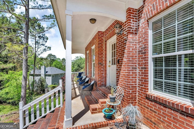 view of patio featuring a porch